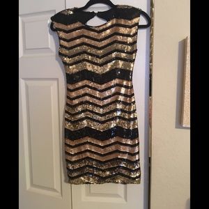 Black and gold sequin dress